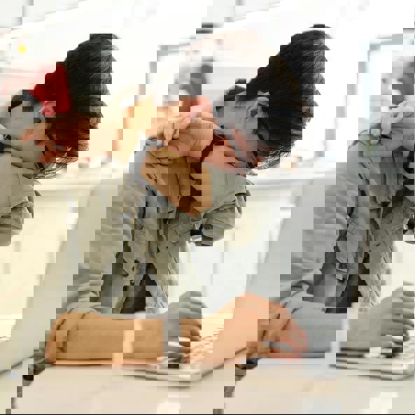 SneeMan sneezing over computer laptop