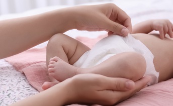 Nappy changing on a baby in a public washroom