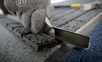 Commercial entrance mat being fitted by phs employee