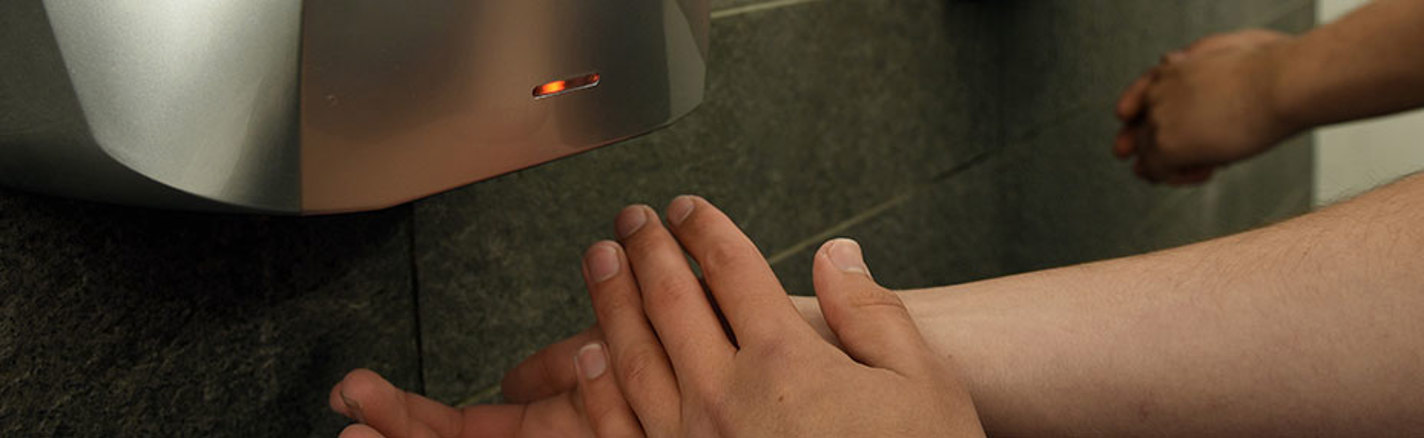 phs AIRSTREAM hand dryer in use in a commercial washroom