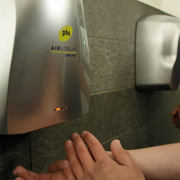 phs AIRSTREAM hand dryer in use in a commercial washroom